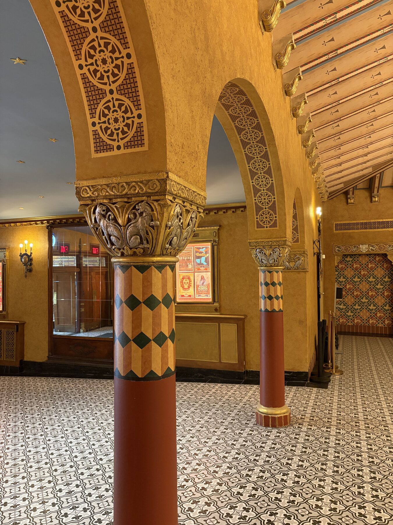 Restored lobby columns, arches, and patterned floor tile