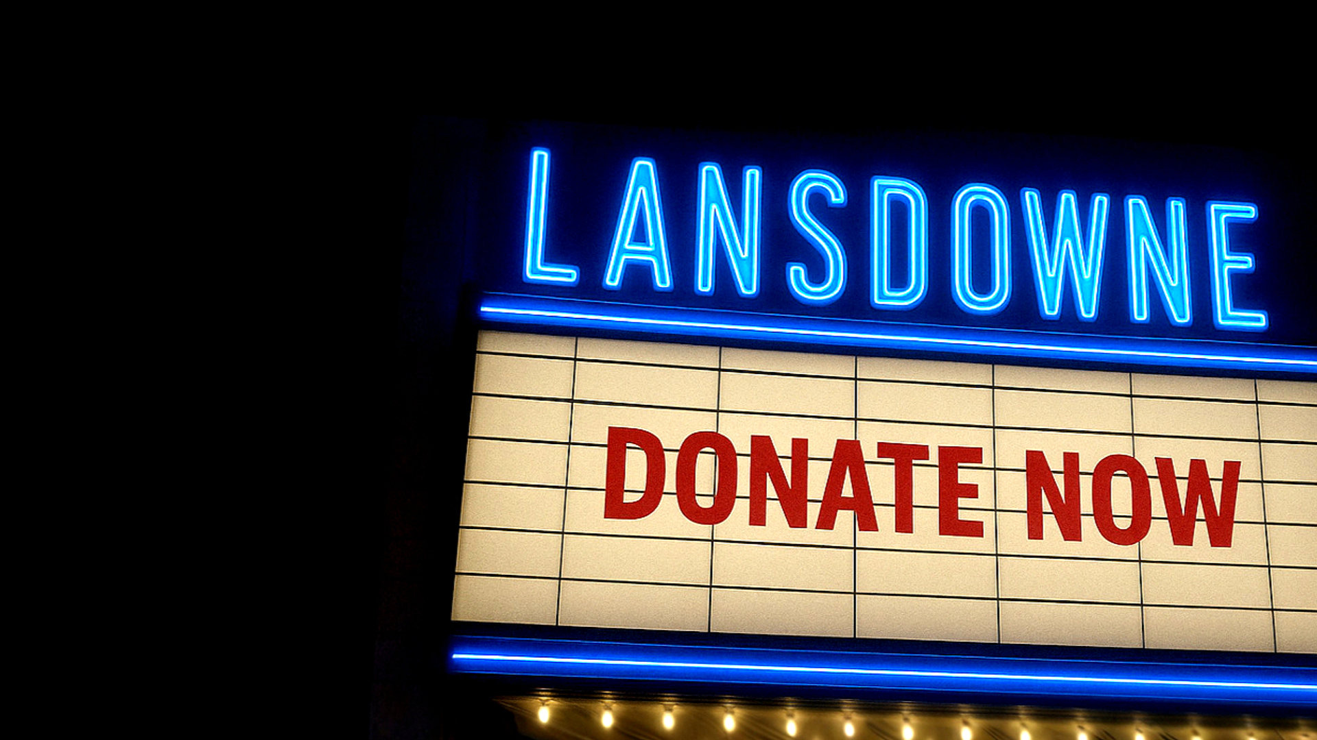 The Lansdowne neon and marquee letterboard reading Donate Now